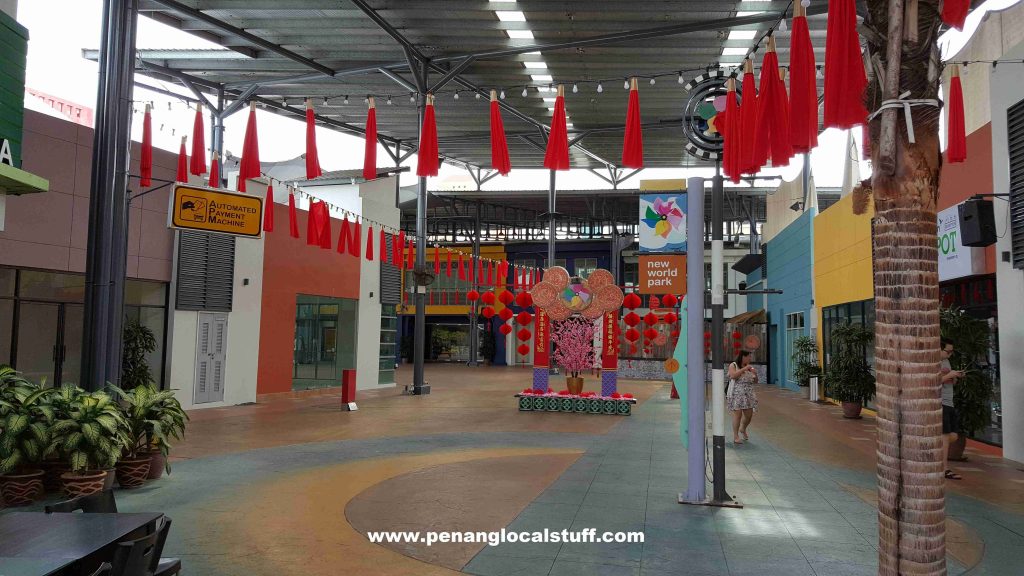 New World Park Pathway With Hanging Red Cloths