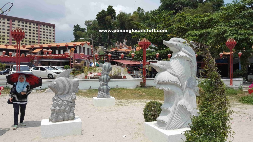 Statues Of Fishes And Dolphins At Tua Pek Kong Temple